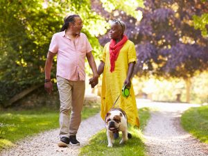 couple walking dog